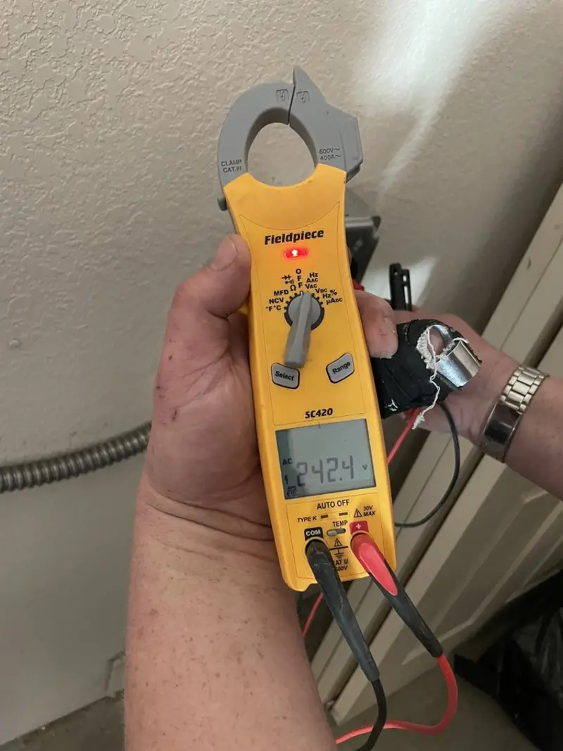 Voltage testing with clamp meter during Electrical Installation Services in St. Augustine Shores